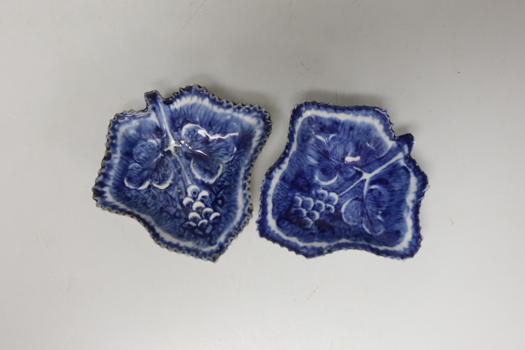An 18th century Bow porcelain octagonal plate and two Bow pickle leaf dishes